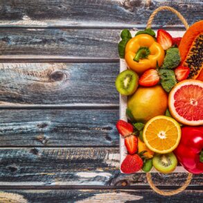 Fruits and vegetables rich in vitamin C in box. Healthy eating.